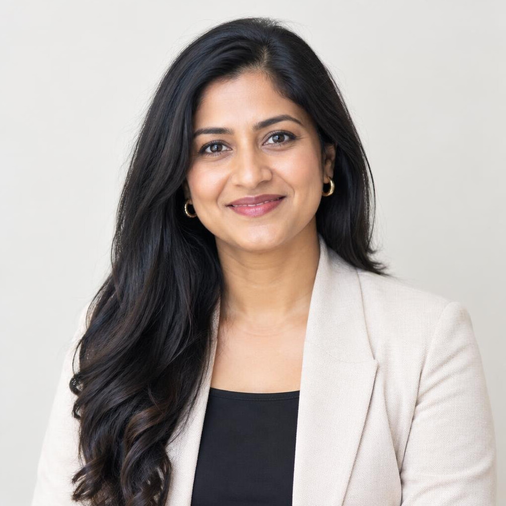 Studio portrait of a South Asian woman in professional attire